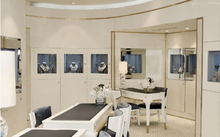 Beverly Hills showroom with David Webb fine jewelry displayed in cases lining the walls of the room