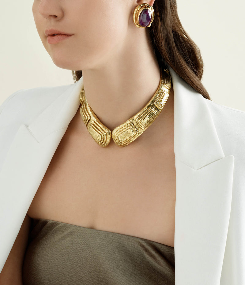 amethyst earrings worn with a hammered gold collar necklace from David Webb