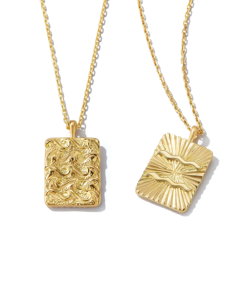 aquarius zodiac pendent necklace made from 18k gold, front and back shown side by side close up