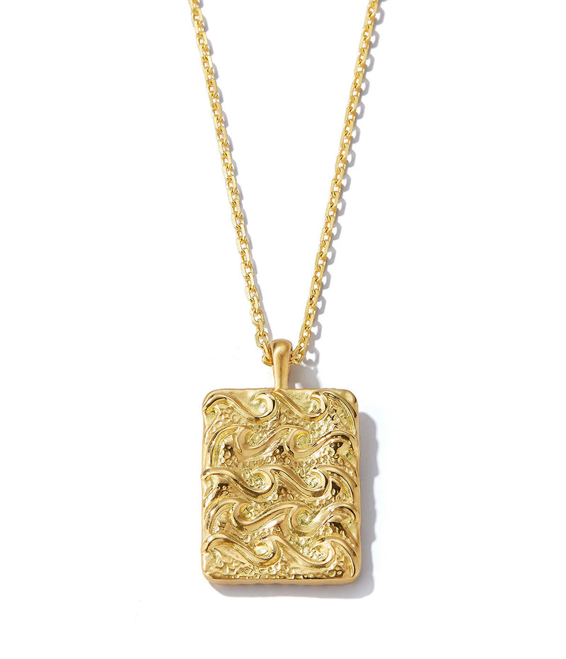 zodiac pendant necklace with 18K gold chain shown close up