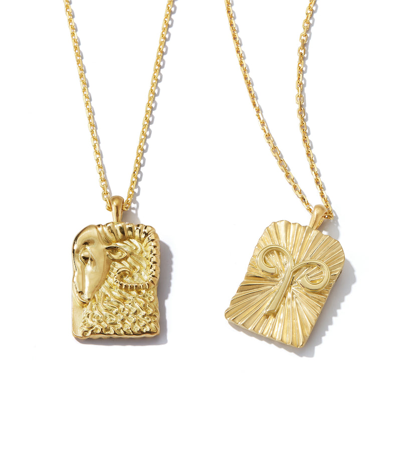 Aries zodiac pendants made from 18k gold, front and back shown side by side close up