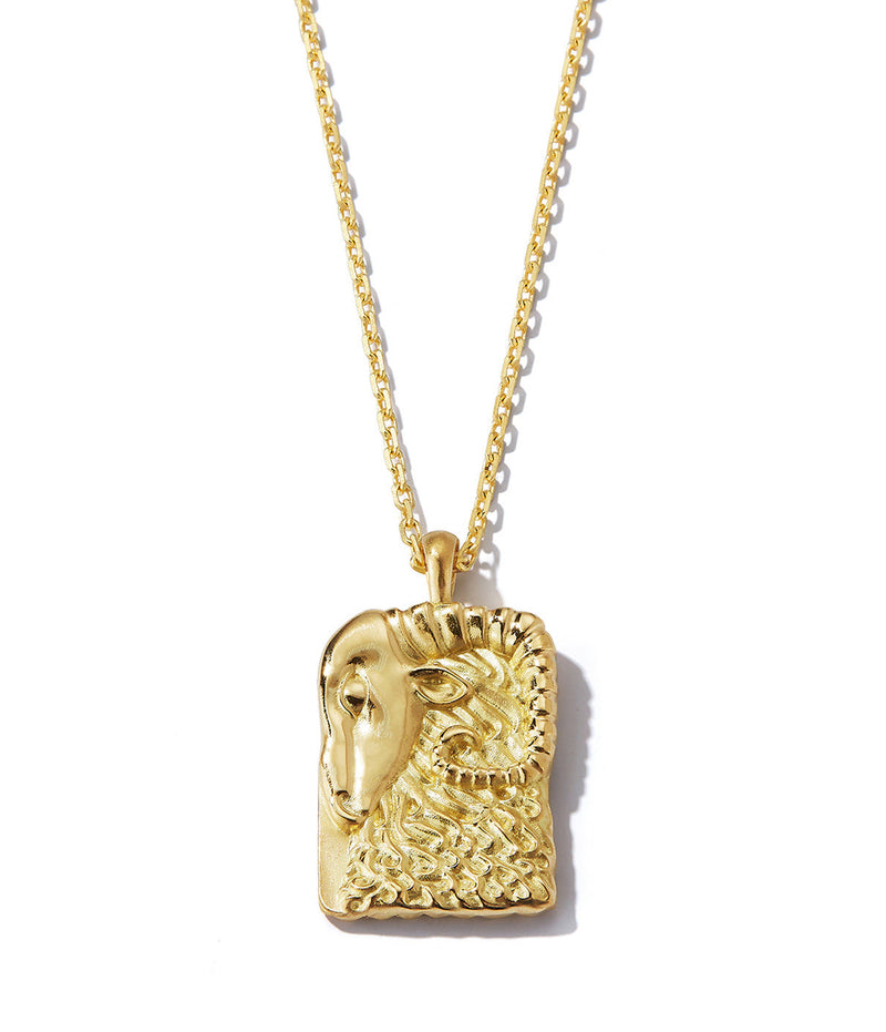 Aries zodiac pendant with gold ram design front side on 18k gold chain shown close up