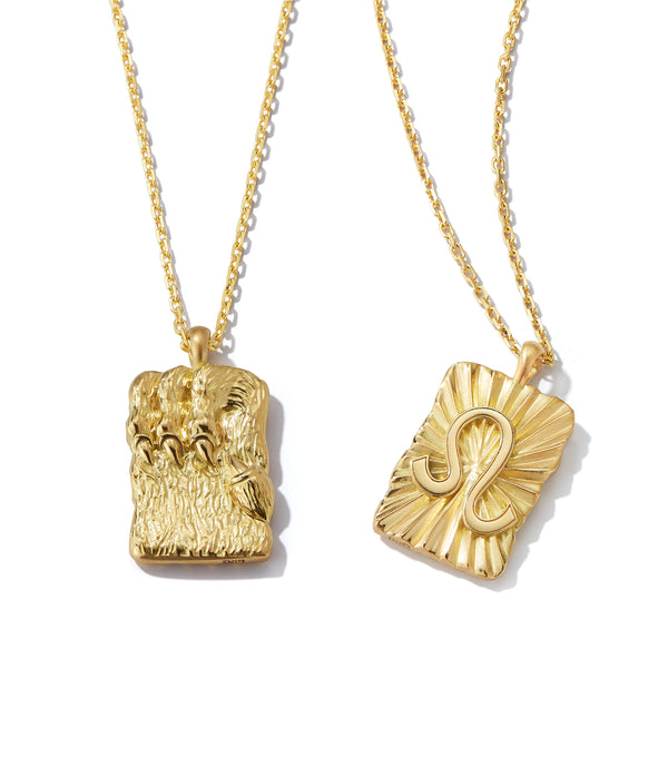 Leo zodiac pendants made from 18k gold, front and back shown side by side on separate gold chains