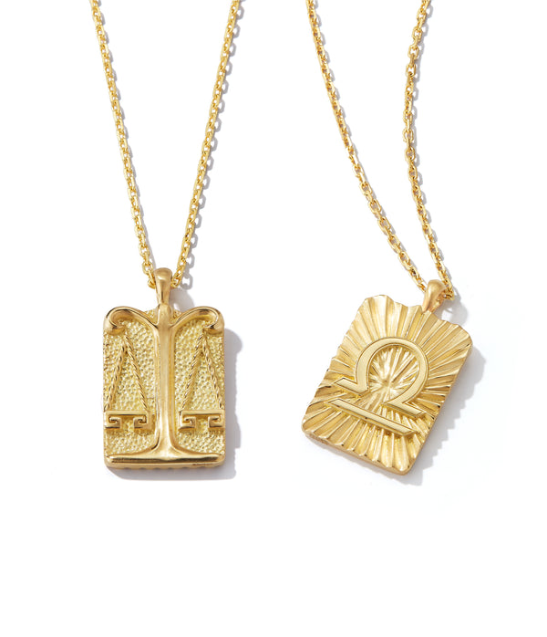Libra zodiac pendants made from 18k gold, front and back shown side by side on separate gold chains