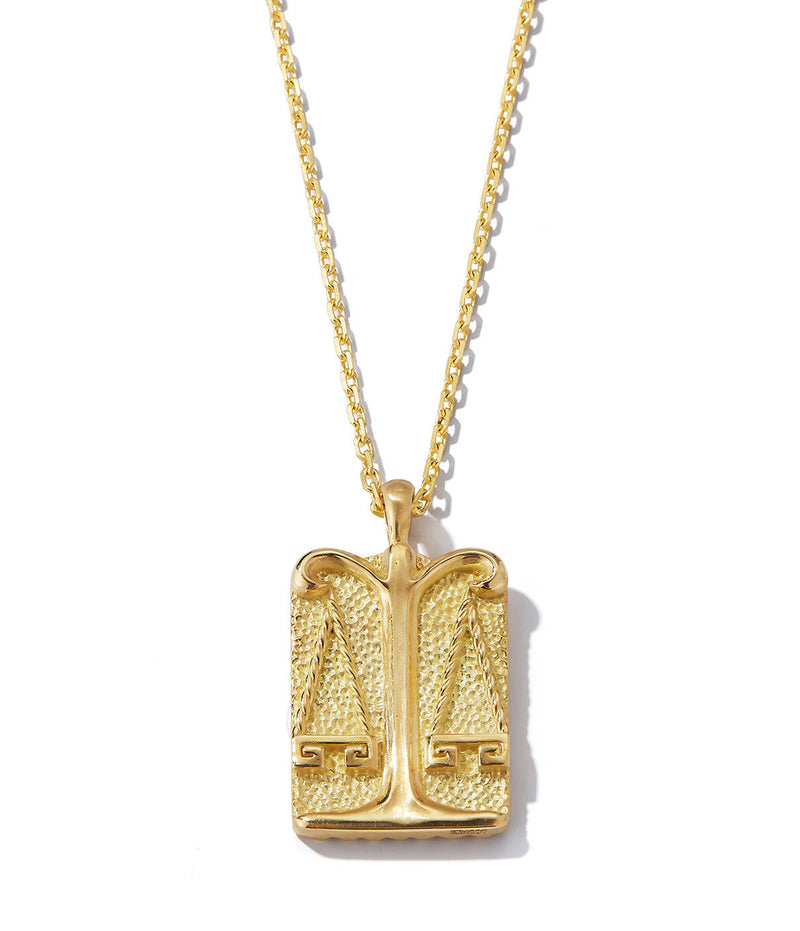 Libra zodiac pendant with gold scales design front side on 18k gold chain necklace shown close up