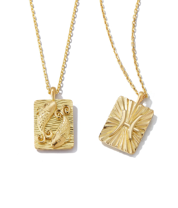 Pisces zodiac pendants made from 18k gold, front and back shown side by side on separate gold chains