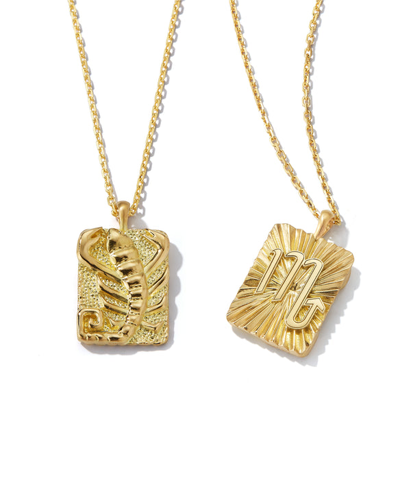 Scorpio zodiac pendants made from 18k gold, front and back shown side by side on separate gold chains