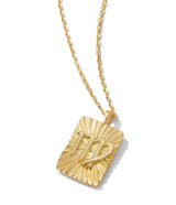 gold pendant with Virgo zodiac sign on 18k gold chain necklace shown against white background